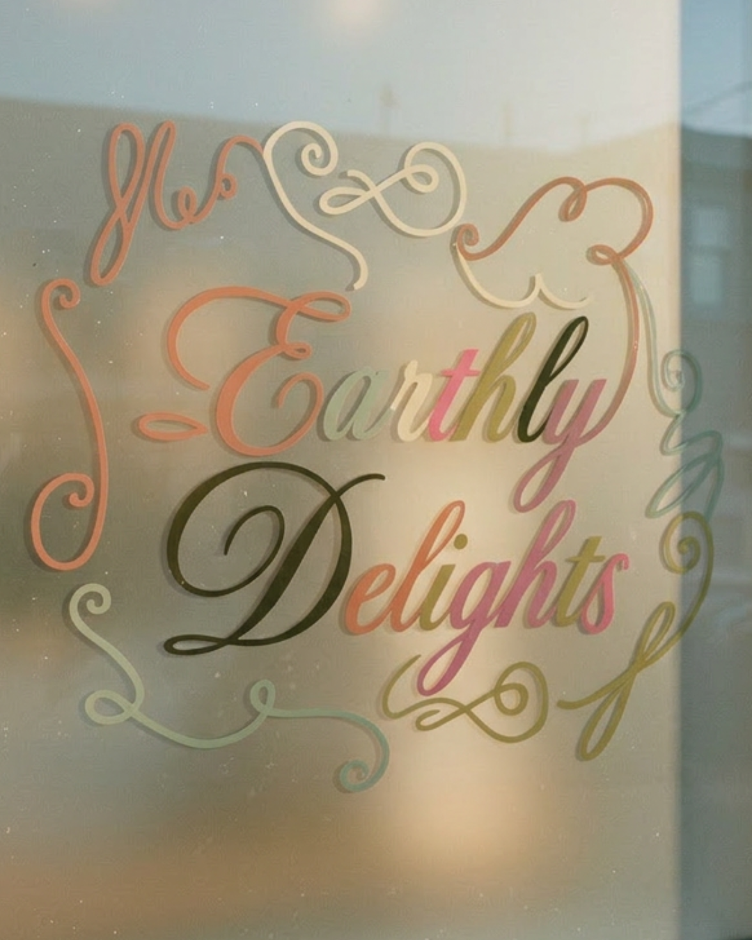 Earthly Delights custom wordmark etched on glass